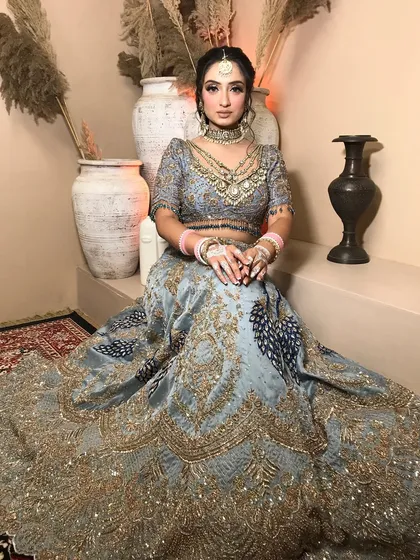 This pose shows the grandeur of the lehenga and how the kundan jewelry adds a layer of royalty to the modern color.