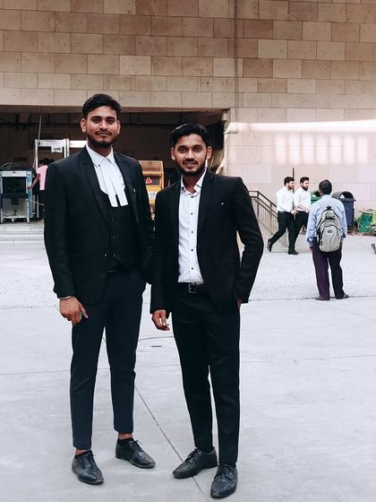 Meeting a friend and fellow advocate at the courthouse. These connections are crucial in the demanding world of criminal law.