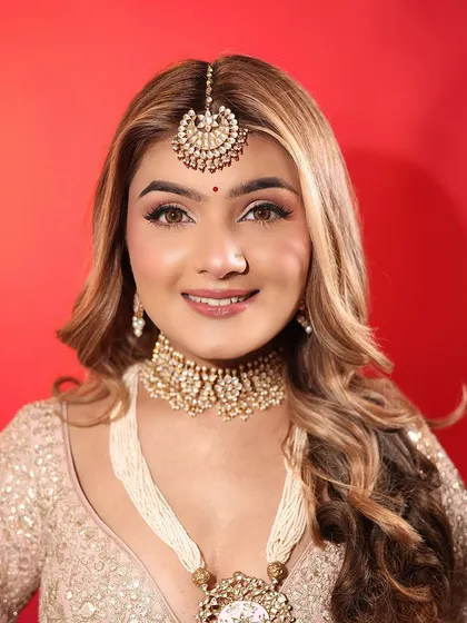A smiling portrait of my day bride. The makeup is light and fresh, enhancing her natural beauty and happiness.