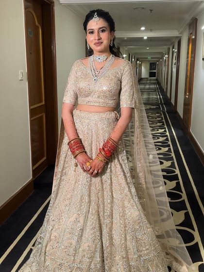 A gorgeous and minimal reception look. The bride is wearing a stunning ivory lehenga, so I kept the makeup soft and elegant with a focus on radiant skin and a simple hairstyle.