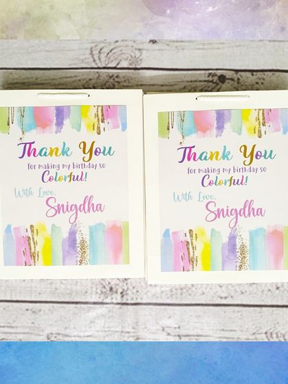 The personalized paper bags for the art party thank guests for making the birthday so colorful, with a lovely watercolor design.