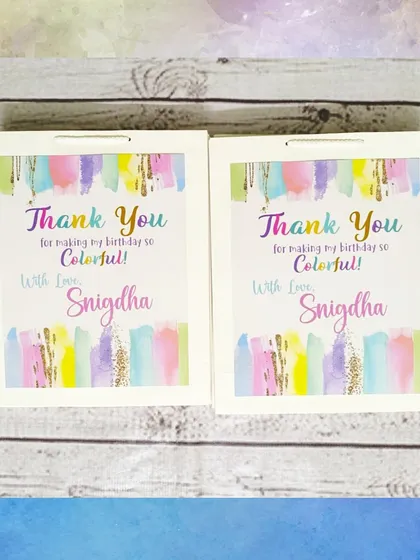 The personalized paper bags for the art party thank guests for making the birthday so colorful, with a lovely watercolor design.