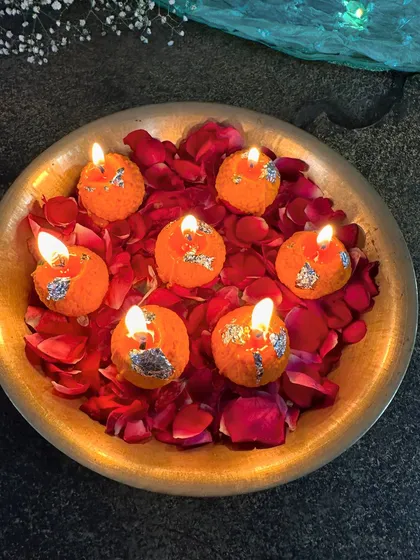 A bowl of my glowing Laddoo candles, creating a warm and inviting ambiance perfect for any festive gathering.