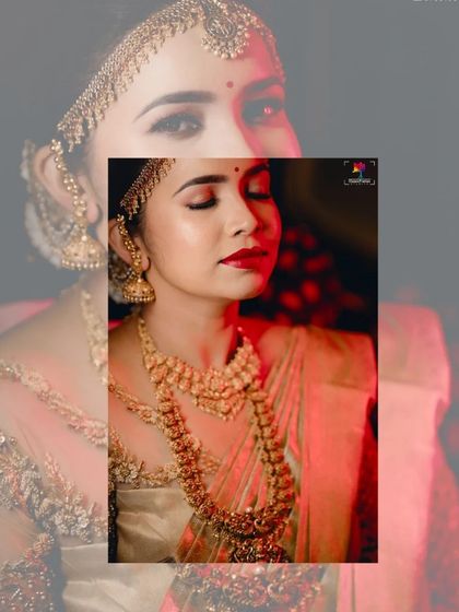 A close-up portrait of the bride, bathed in dramatic red light. This artistic shot highlights her intricate jewelry and serene expression, creating a powerful image.