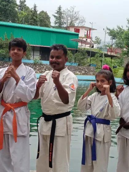 Another great team photo by the water. The different colored belts show the mix of experience levels we have at our camp, where everyone learns from each other.