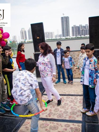 A hula hoop challenge in full swing. We plan age-appropriate games and activities that get everyone involved and having a great time.