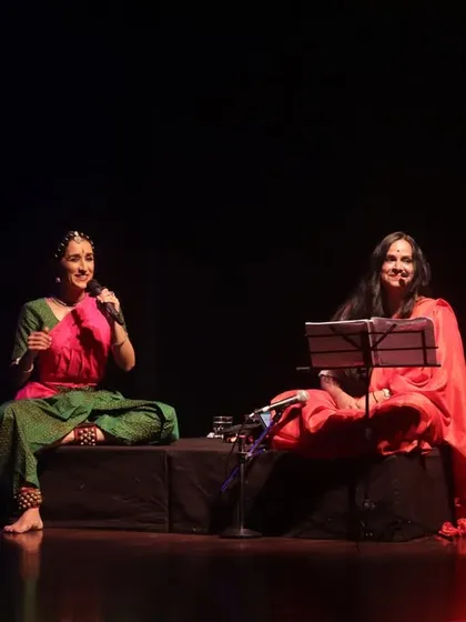 A seated moment of dialogue on stage during 'Mandala'. Sometimes the most powerful communication happens in stillness, in the simple act of listening.