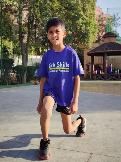 Challenge your limits to discover new possibilities. This young player demonstrates the focus and effort we encourage in every drill, pushing himself to improve his strength and balance.