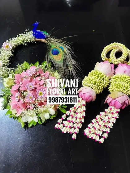 Another beautiful baby shower set featuring lotus bud kalire and a matching floral purse with a peacock design.