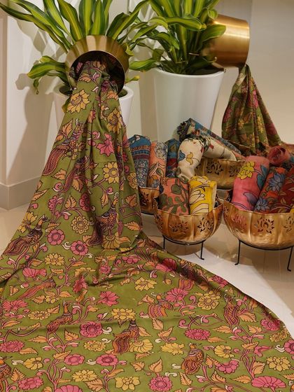 This is a glimpse into my Kalamkari Edition, featuring a wide array of hand-painted dupattas and fabrics from the Indralokam series. Each piece is a unique story, available for you to customize into your dream outfit.