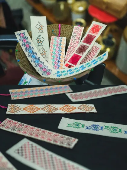 A variety of handcrafted Kasuti bookmarks ready for the Kasuti Katha exhibition in Mumbai. Each one is unique, showcasing different patterns and color combinations.