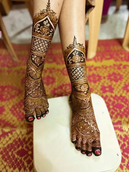 Don't forget the feet! I design stunning bridal foot mehndi that complements your hand designs. This full-coverage leg design features traditional motifs perfect for a bride.