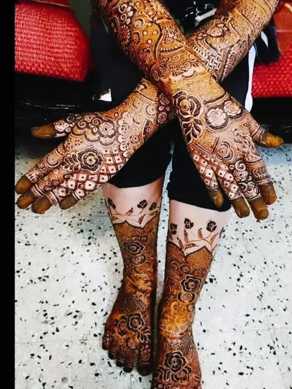The complete bridal mehndi for Farheen, showing the detailed work on her hands and feet, and the beautiful final stain.
