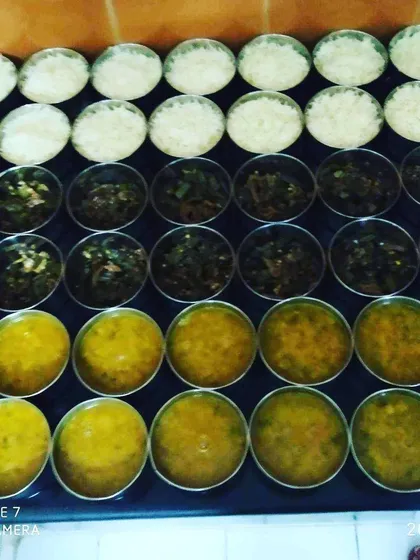 A behind the scenes look at our kitchen. We prepare dozens of tiffins every day, ensuring each one is filled with fresh, hot food. This shows our commitment to serving many happy customers across Greater Noida.