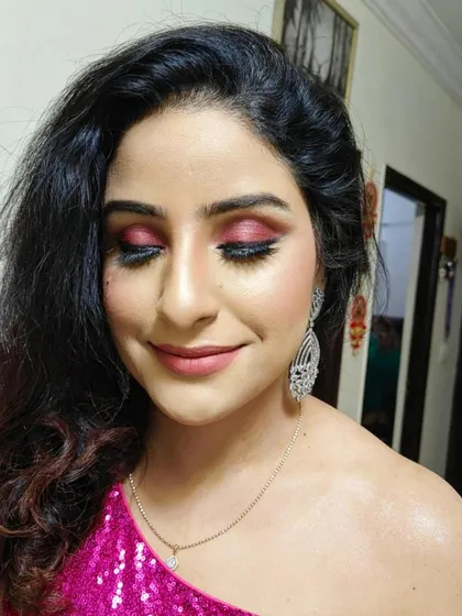 A close-up of the pink smokey eye. You can see the careful blending of colors and the long, dramatic lashes that make this look so captivating.