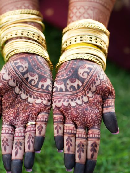 Another shot of the dark stain with gold bangles, a classic bridal combination.