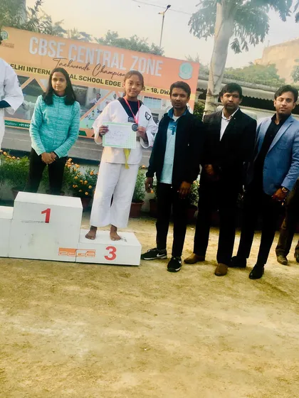 Prachi Thapa receiving her bronze medal at the CBSE Central Zone Taekwondo Championship. Consistent performance is what we strive for.