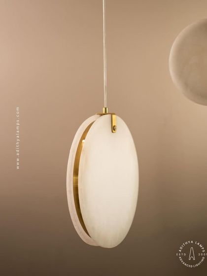 Showcasing our disc-shaped marble pendants. The light emanates softly through the thin slice of natural marble, revealing its unique veining. These fixtures are available in different shapes and look stunning hung in pairs or trios.