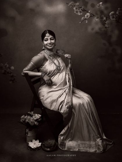 A beautiful, classic portrait of a mother-to-be in a traditional saree, the monochrome tones adding a sense of timelessness and grace.