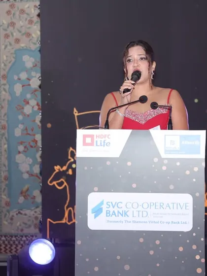 Speaking at the HDFC Life and SVC Bank gala. My role is to keep the energy up while maintaining the professional decorum required for a corporate awards night.