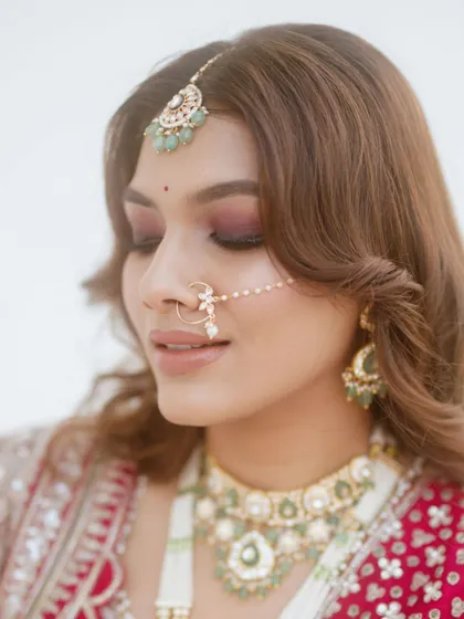 Another angle of the bride's stunning phera look, highlighting the delicate nath (nose ring) and the soft, blended eyeshadow that makes her eyes pop.