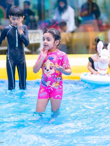 A girl in a Paw Patrol swimsuit enjoying the pool. I can tailor parties to incorporate any of your child's favorite characters, even in a pool setting.