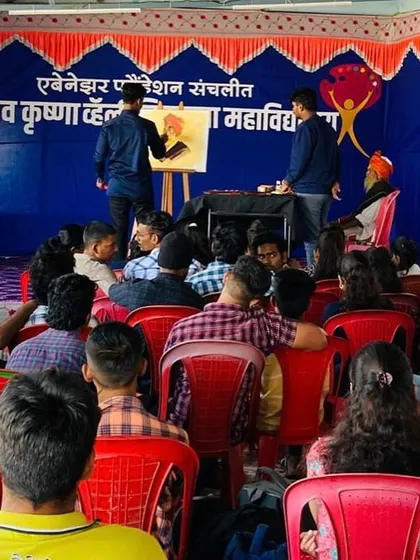 A wider view of the workshop at Nav Krishna Valley College, showing the model and the artwork taking shape on the easel. These events are a fantastic opportunity for aspiring artists to see professional techniques firsthand.