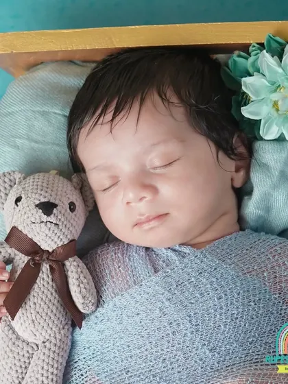 A detailed close-up of the sleeping newborn and his teddy bear. We focus on capturing these tiny, heartwarming details for you to cherish.