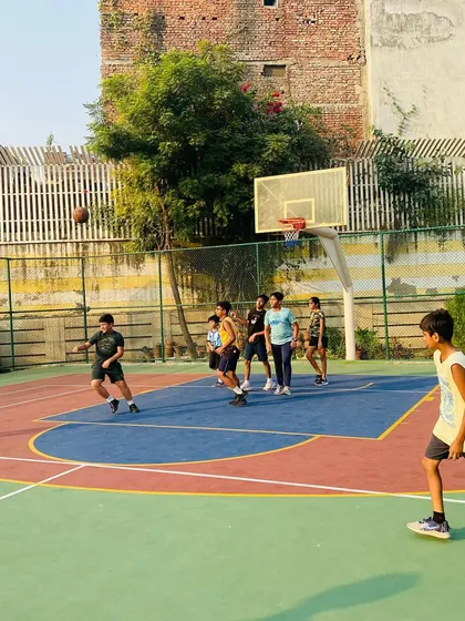 A player dribbles past a defender in a morning practice game.