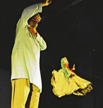 A moment of pure energy on stage. Here, I am performing with a dancing puppet, lost in the story and the music. We bring this passion to every show, making the kathputli dance, fight, and fly.
