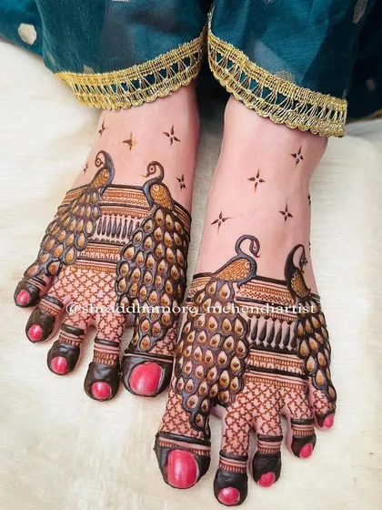 Bridal feet deserve just as much love and detail. Here, I designed a striking pair of peacocks whose feathers gracefully cover the feet, creating a bold and elegant statement for the bride's special day.