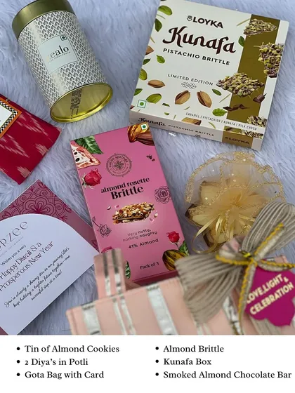Here’s what’s inside our popular gota bag hamper. It includes a tin of almond cookies, almond brittle, a kunafa box, and diyas in a small potli, offering a wonderful mix of flavors and festive essentials.