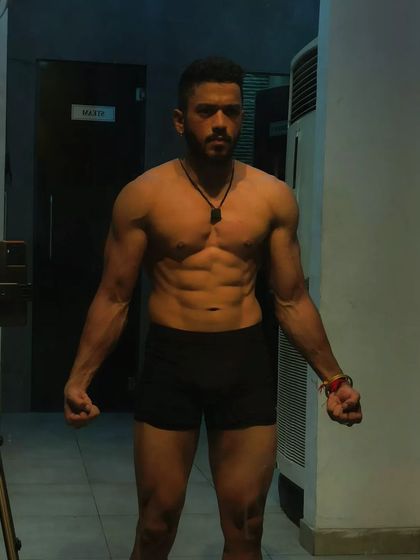 A powerful front pose. This is the look of someone who is in control of their body and their life.