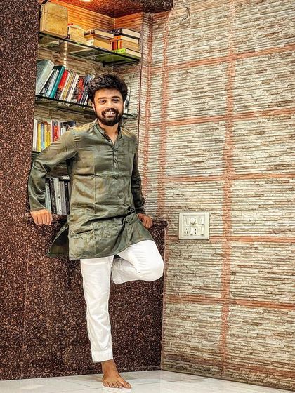 A simple photo in my home, dressed in traditional Indian wear. This is me, grounded in my roots, surrounded by my books and my space.