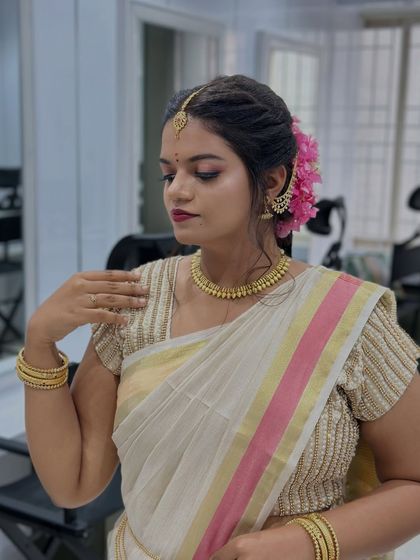 Another beautiful bridal look created by our students. We focus on teaching techniques that enhance natural beauty while incorporating traditional elements like fresh flowers and gold jewelry.
