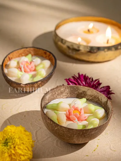 These coconut shell candles are filled with jasmine and lotus bud motifs, perfect for a serene, spa-like atmosphere.