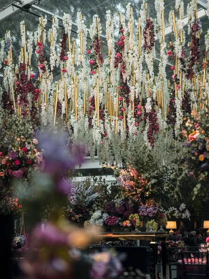 For a Bridgerton-themed Sangeet, we designed this breathtaking floral ceiling. Thousands of wisteria and roses hung overhead, creating a romantic, immersive atmosphere that transported guests to another era.