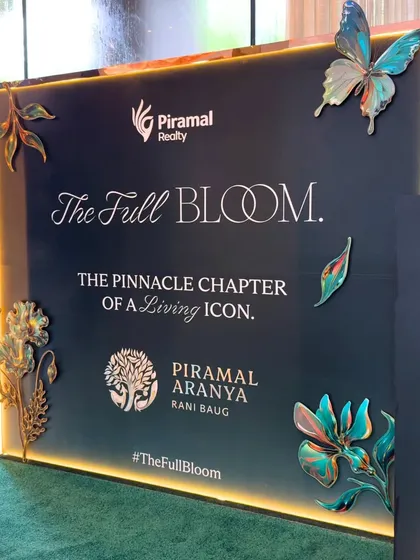 Details matter. This close-up shows the 3D metallic butterflies and foliage on the Piramal Realty photo booth, adding a layer of sophistication and texture that elevates the entire setup.