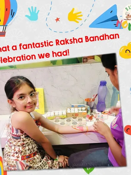Our Raksha Bandhan celebration included a fantastic craft session where siblings could make personalized gifts for each other. Here, a girl is getting help with her creation at our art table.