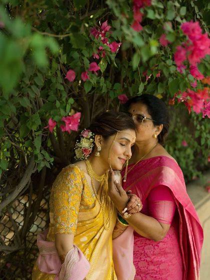 A mother's gentle kiss on her daughter's forehead, a blessing filled with love. We focus on capturing the deep bonds between family members.