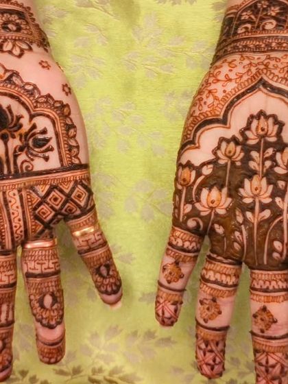 Another view of the beautiful mother-daughter Diwali henna, with intricate lotus patterns.