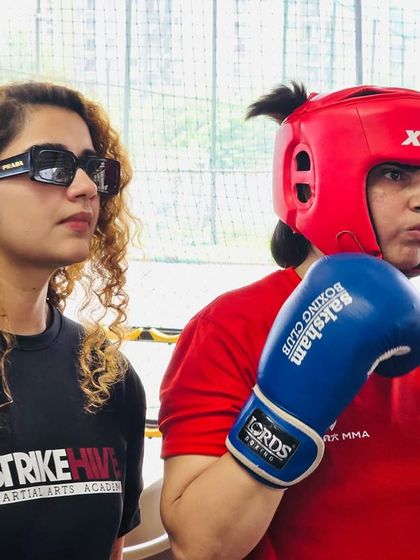 Our founder coaches a student from the sidelines during a competition, providing guidance and support when it matters most.