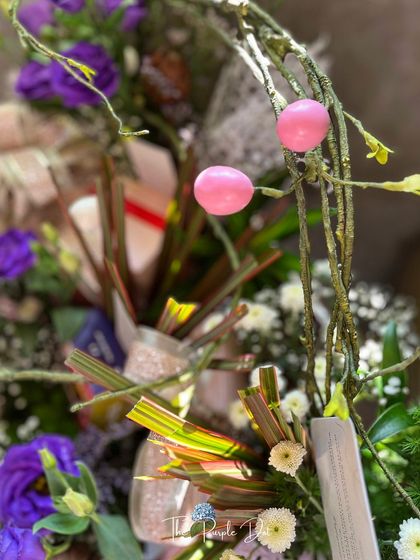 Whimsical pink accents and natural branches add an artistic, unexpected touch to this executive gift. It demonstrates my belief that corporate gifting can be both professional and creative.