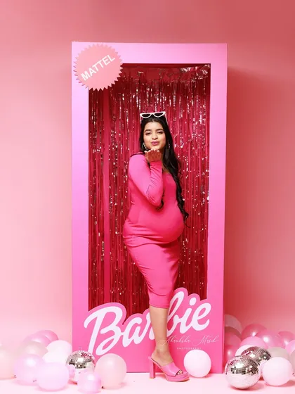 For the fun-loving mom who is a Barbie girl at heart. This playful, life-sized Barbie box setup is a vibrant and joyous way to celebrate your pregnancy with a touch of fantasy and glamour.