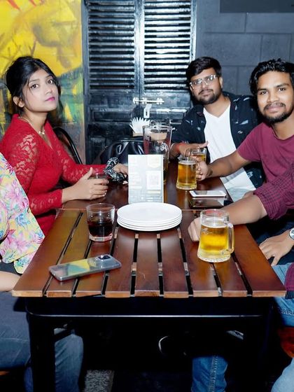 A group enjoying their drinks and the music. I can provide a more relaxed, background vibe for the earlier parts of an evening before turning up the energy for the dance floor.