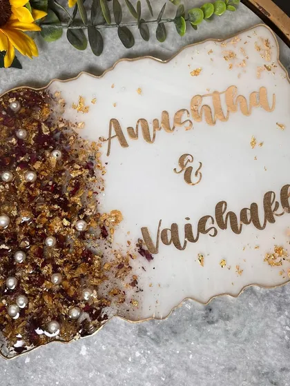 A top-down view of the garland preservation nameplate. The organic, geode-like edge and the elegant design make it a perfect piece of home decor.
