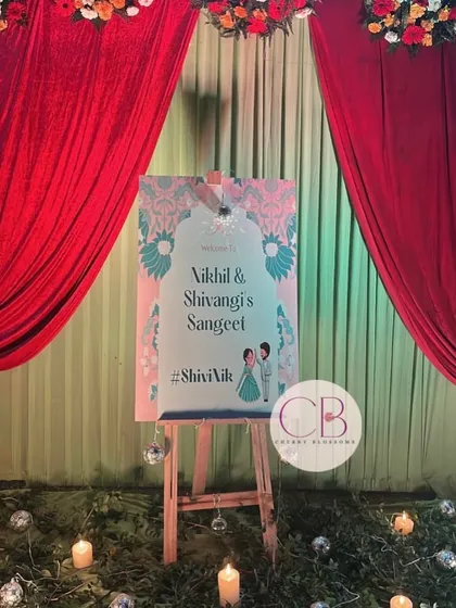 A personalized welcome easel for a Sangeet and Cocktail night. We designed this welcome sign with a custom caricature of the couple, setting a fun and personal tone right from the entrance.
