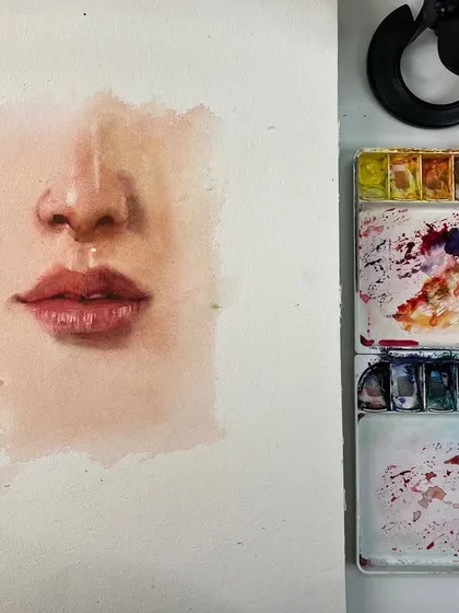 The nose and lips study on my desk, next to the palette. This shows the simple colors used to create realistic skin tones.