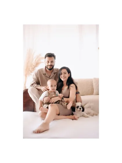 A classic family portrait with their beloved pet. This shot captures the whole family, creating a memory they can all look back on and smile.