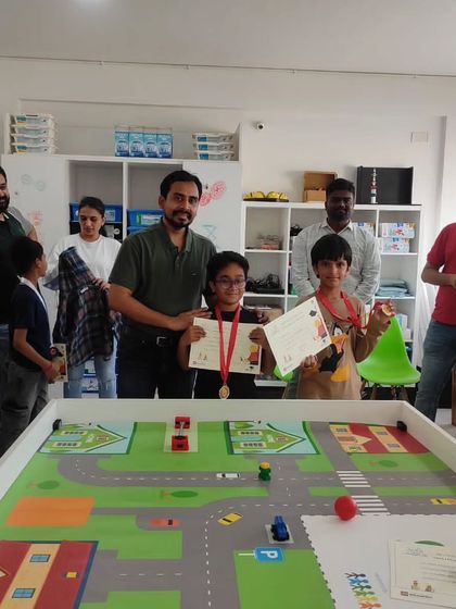 Proud winners receiving their certificates and medals. Our competitions are a great way for students to showcase the skills they've learned and be recognized for their hard work.